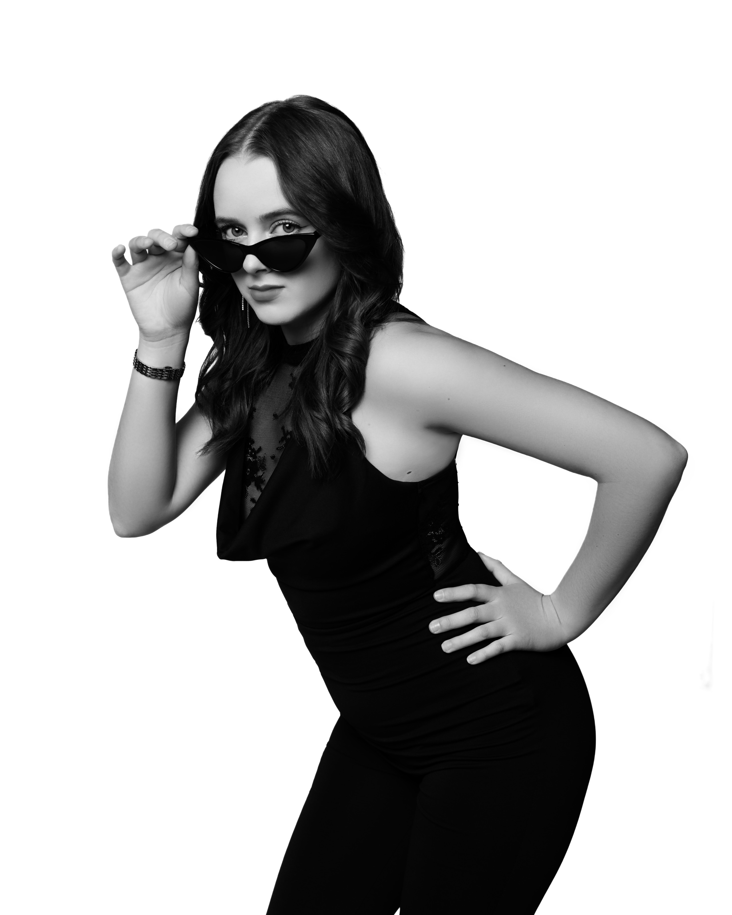 Studio portrait in a black jumpsuit, elegant style - photograph 10